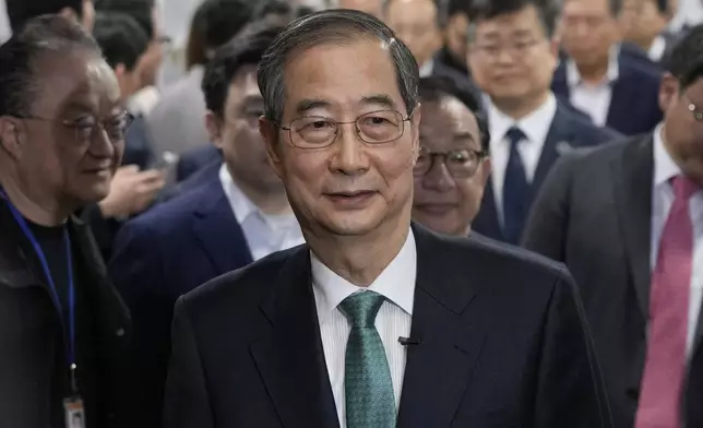 South Korean former Prime Minister Han Duck-soo arrives to hold a press conference to announce a presidential bid at the National Assembly in Seoul, South Korea, Friday, May 2, 2025. (AP Photo/Ahn Young-joon)