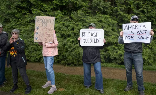 Demonstrators protest near Trump National Golf Club Washington DC before the arrival of President Donald Trump in Sterling, Va., Thursday, May 22, 2025. (AP Photo/Rod Lamkey, Jr.)