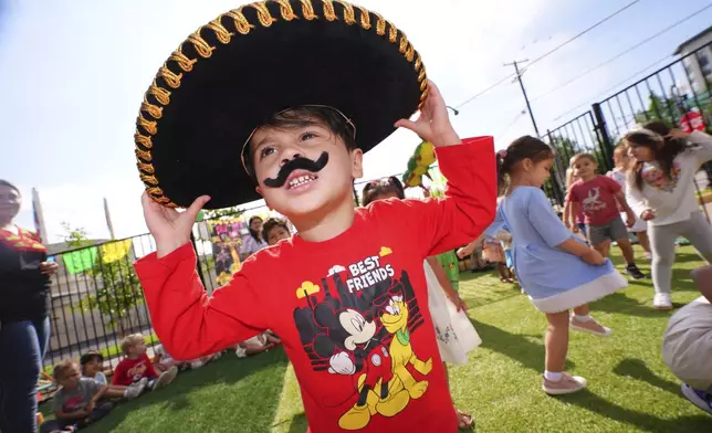 Saul Garcia, 3, wears a sombrero during a Cinco de Mayo celebration at the Yorktown Spanish School in Dallas, Monday, May 5, 2025. (AP Photo/LM Otero)