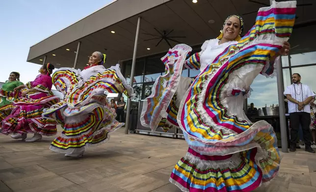 FILE - Folklorico dancers from the group Viva Mexico perform their routine during a Cinco de Mayo celebration and mixer hosted by the Odessa Hispanic Chamber of Commerce at the Odessa Marriott Hotel and Convention Center, May 5, 2021, in Odessa, Texas. (Eli Hartman/Odessa American via AP, File)