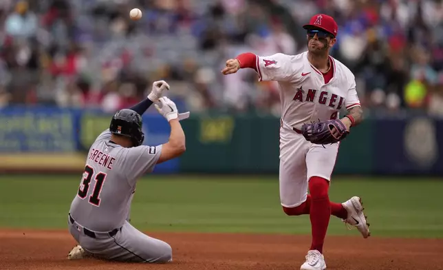 Detroit Tigers' Riley Greene, left, is forced out at second as Los Angeles Angels shortstop Zach Neto throws out Spencer Torkelson at first during the fifth inning of a baseball game Sunday, May 4, 2025, in Anaheim, Calif. (AP Photo/Mark J. Terrill)