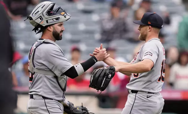 Detroit Tigers catcher Tomás Nido, left, and pitcher Will Vest congratulate each other after the Tigers defeated the Los Angeles Angels 13-1 in a baseball game Sunday, May 4, 2025, in Anaheim, Calif. (AP Photo/Mark J. Terrill)