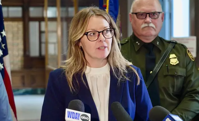 Acting U.S. Attorney Lisa D. Kirkpatrick spoke to reporters following the sentencing of Harshkumar Ramanlal Patel and Steve Anthony Shand, who were convicted on human smuggling charge related to the 2022 deaths of an Indian family who froze while crossing into the U.S. from Canada, on Wednesday, May 28, 2025, in Fergus Falls, Minn. (AP Photo/Mark Vancleave)