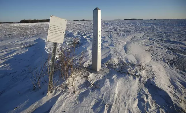 FILE - A border marker, between the United States and Canada is shown just outside of Emerson, Manitoba, on Thursday, Jan. 20, 2022. (John Woods/The Canadian Press via AP, File)