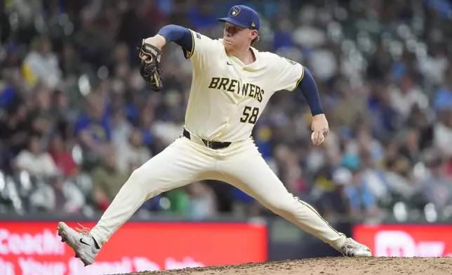 Milwaukee Brewers' Rob Zastryzny pitches during the 10th inning of a baseball game against the Boston Red Sox, Tuesday, May 27, 2025, in Milwaukee. (AP Photo/Aaron Gash)