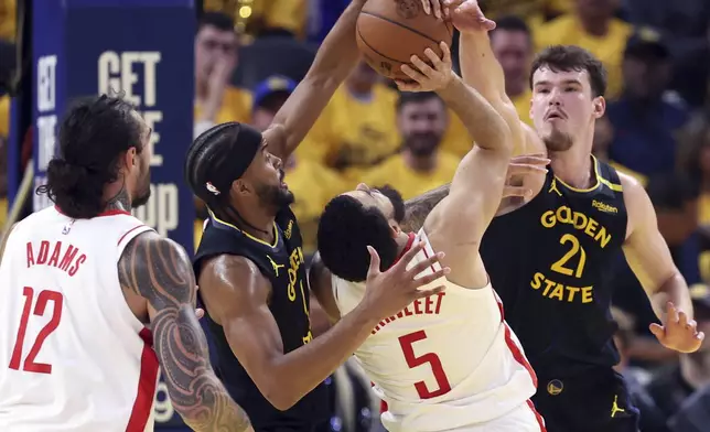 Golden State Warriors' Moses Moody, second from left, and Quinten Post, right, defend against Houston Rockets' Fred VanVleet (5) in the second quarter of Game 6 of an NBA basketball first-round playoff series Friday, May 2, 2025, in San Francisco. A foul was called on the Warriors on the play. (Scott Strazzante/San Francisco Chronicle via AP)