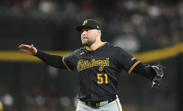 Pittsburgh Pirates pitcher David Bednar celebrates a win after the final out against the Arizona Diamondbacks during the ninth inning of a baseball game Tuesday, May 27, 2025, in Phoenix. (AP Photo/Ross D. Franklin)