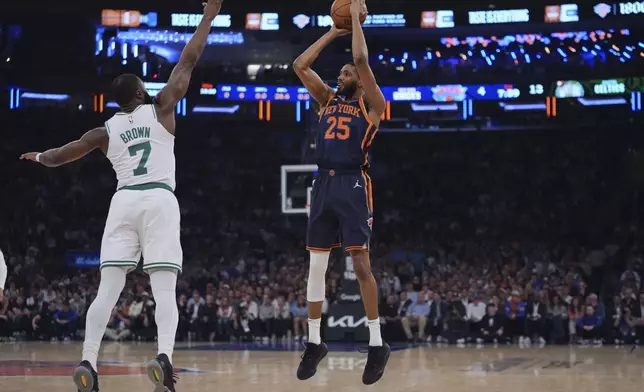 New York Knicks' Mikal Bridges (25) shoots over Boston Celtics' Jaylen Brown (7) during the first half of Game 4 in the Eastern Conference semifinals of the NBA basketball playoffs Monday, May 12, 2025, in New York. (AP Photo/Frank Franklin II)