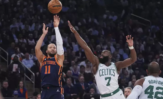 New York Knicks' Jalen Brunson (11) shoots over Boston Celtics' Jaylen Brown (7) during the first half of Game 4 in the Eastern Conference semifinals of the NBA basketball playoffs Monday, May 12, 2025, in New York. (AP Photo/Frank Franklin II)