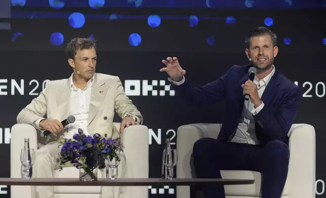 Eric Trump, Executive VP of The Trump Organization, right, speaks as Co-founder of World Liberty Financial Zach Witkoff looks on during Token 2049, a Crypto event, in Dubai, United Arab Emirates, Thursday, May 1, 2025. (AP Photo/Altaf Qadri)