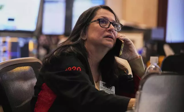 Trader Phyllis Arena Woods works on the floor of the New York Stock Exchange, Tuesday, May 6, 2025. (AP Photo/Richard Drew)