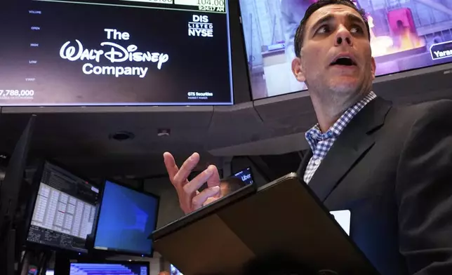 Trader Craig Spector works on the floor of the New York Stock Exchange, Wednesday, May 7, 2025. (AP Photo/Richard Drew)