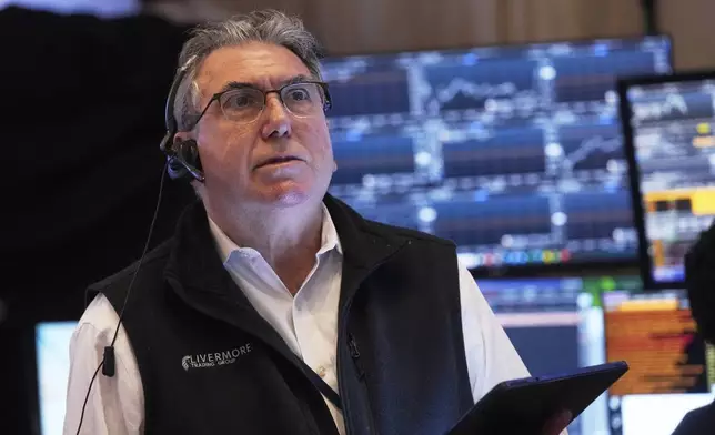 Trader John Bishop works on the floor of the New York Stock Exchange, Thursday, May 1, 2025. (AP Photo/Richard Drew)