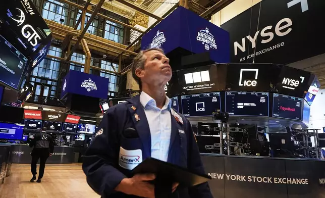 Trader Robert Charmak works on the floor of the New York Stock Exchange, Tuesday, May 6, 2025. (AP Photo/Richard Drew)