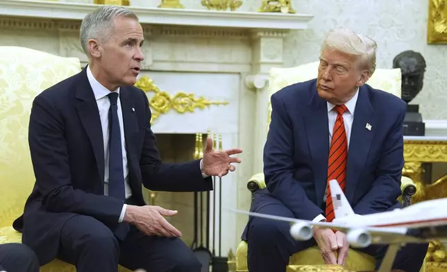 President Donald Trump meets Canadian Prime Minister Mark Carney in the Oval Office of the White House, Tuesday, May 6, 2025, in Washington. (AP Photo/Evan Vucci)