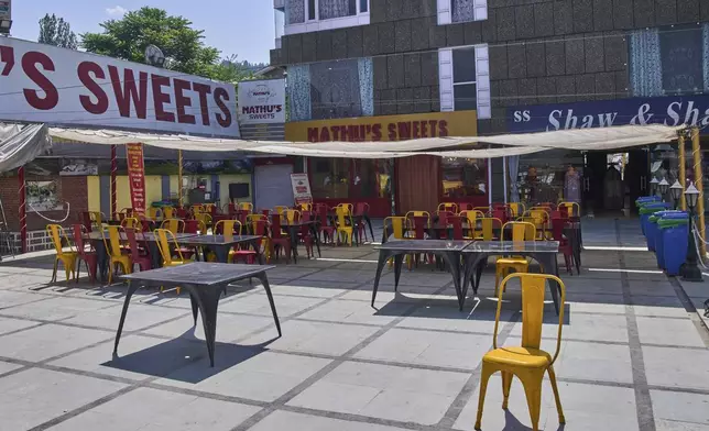 Tables and chairs outside a restaurant wearing a deserted look near Dal Lake in Srinagar, Indian controlled Kashmir, India, Tuesday, May 20, 2025. (AP Photo/Dar Yasin)