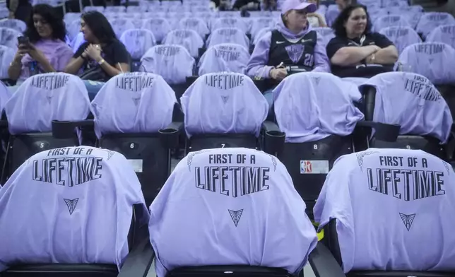 Golden State Valkyries t-shirts are placed on seats for fans at Chase Center before a WNBA basketball game between the Valkyries and the Los Angeles Sparks in San Francisco, Friday, May 16, 2025. (AP Photo/Jeff Chiu)