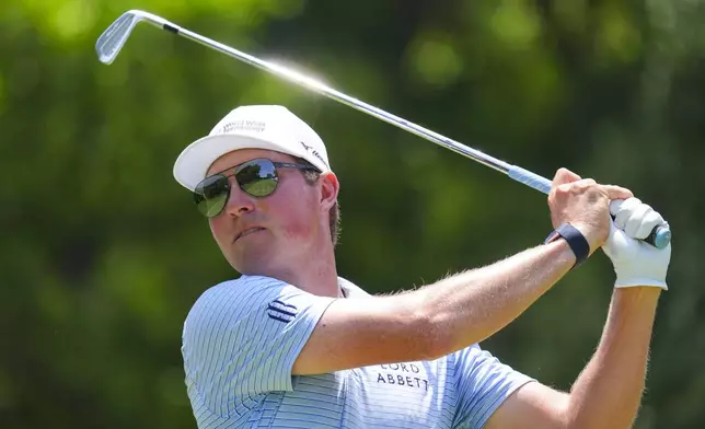 Ben Griffin watches his tee shot on the fourth hole during the final round of the Charles Schwab Challenge golf tournament at Colonial Country Club in Fort Worth, Texas, Sunday, May 25, 2025. (AP Photo/LM Otero)