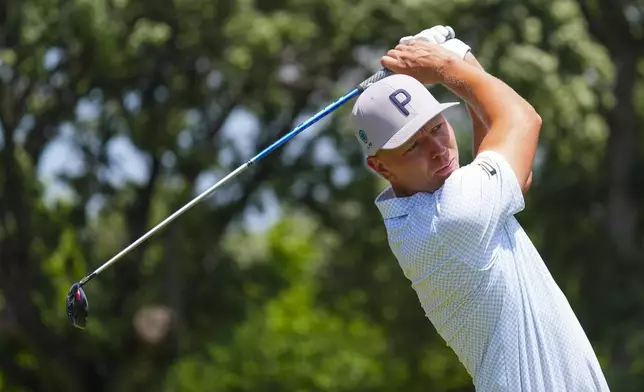 Matti Schmid hits a tee shot on the third hole during the final round of the Charles Schwab Challenge golf tournament at Colonial Country Club in Fort Worth, Texas, Sunday, May 25, 2025. (AP Photo/LM Otero)