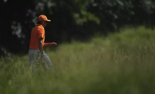 Rickie Fowler walks toward the 17th green during the final round of the Charles Schwab Challenge golf tournament at Colonial Country Club in Fort Worth, Texas, Sunday, May 25, 2025. (AP Photo/Julio Cortez)