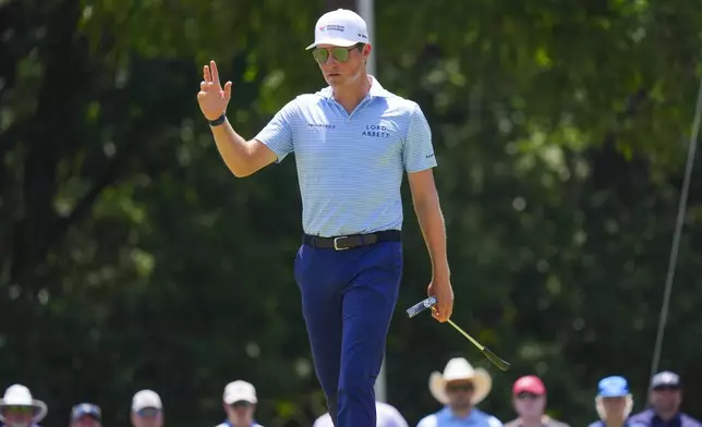 Ben Griffin reacts after a putt on the third hole during the final round of the Charles Schwab Challenge golf tournament at Colonial Country Club in Fort Worth, Texas, Sunday, May 25, 2025. (AP Photo/LM Otero)