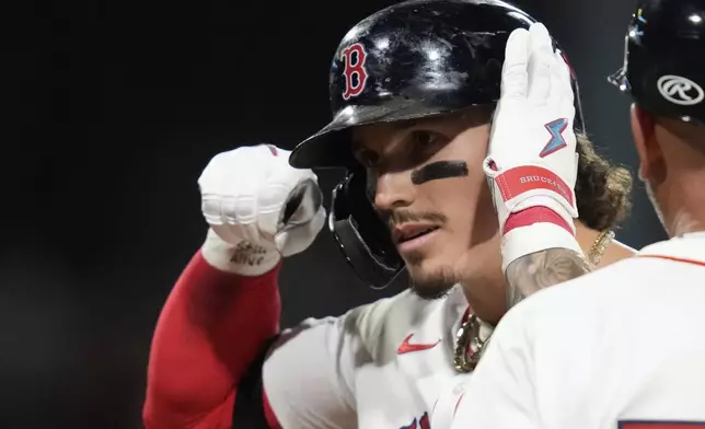 Boston Red Sox's Jarren Duran celebrates after his RBI single during the eighth inning of a baseball game against the Minnesota Twins at Fenway Park, Friday, May 2, 2025, in Boston. (AP Photo/Charles Krupa)
