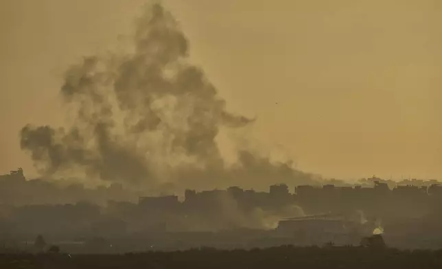 Smoke rises following an Israeli army bombardment in the Gaza Strip, seen from southern Israel, Wednesday, May 21, 2025. (AP Photo/Ohad Zwigenberg)