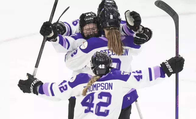 Minnesota Frost players celebrate after a goal by Lee Stecklein (2) against the Toronto Sceptres during second-period PWHL playoff hockey game action in Toronto, Friday, May 9, 2025. (Chris Young/The Canadian Press via AP)
