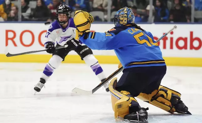 Toronto Sceptres goaltender Kristen Campbell (50) makes a save against Minnesota Frost's Taylor Heise (27) during third-period PWHL playoff hockey game action in Toronto, Friday, May 9, 2025. (Frank Gunn/The Canadian Press via AP)