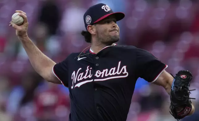 Washington Nationals pitcher Kyle Finnegan throws in the during the ninth inning of a baseball game against the Cincinnati Reds, Sunday, May 4, 2025, in Cincinnati. (AP Photo/Carolyn Kaster)