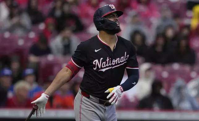 Washington Nationals' Luis García Jr. watches his solo home run during the seventh inning of a baseball game against the Cincinnati Reds, Sunday, May 4, 2025, in Cincinnati. (AP Photo/Carolyn Kaster)