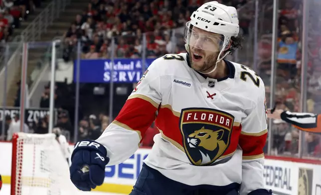 Florida Panthers' Carter Verhaeghe (23) celebrates his goal against the Carolina Hurricanes during first period of Game 1 of the NHL hockey Stanley Cup Eastern Conference finals in Raleigh, N.C., Tuesday, May 20, 2025. (AP Photo/Karl DeBlaker)