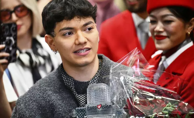 JJ, center, from Austria arrives at the airport in Vienna, Austria, Sunday, May 18, 2025, after winning the Grand Final of the 69th Eurovision Song Contest, in Basel yesterday. (AP Photo/Denes Erdos)