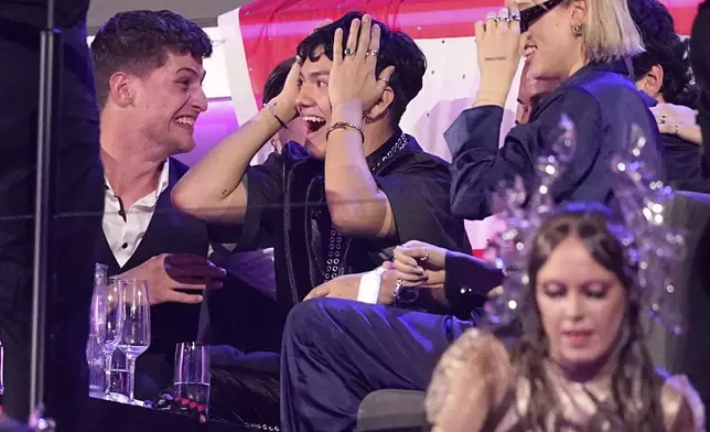 JJ from Austria who performed the song "Wasted Love" reacts to voting during the Grand Final of the 69th Eurovision Song Contest, in Basel, Switzerland, early Sunday, May 18, 2025. (AP Photo/Martin Meissner)