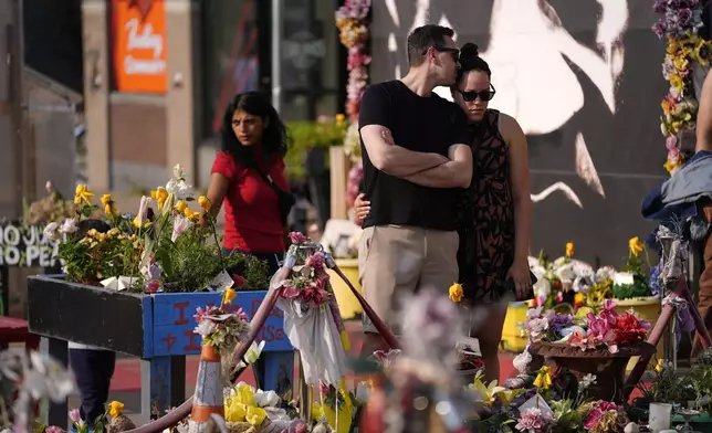 People visit George Floyd Square on the five-year anniversary of Floyd's death, Sunday, May 25, 2025, in Minneapolis. (AP Photo/Abbie Parr)