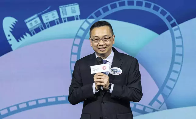 Benson Kwok, director of Immigration, speaks during the naming ceremony of the Hong Kong-born giant panda twin cubs Jia Jia and De De in Hong Kong, Tuesday, May 27, 2025. (AP Photo/Chan Long Hei)