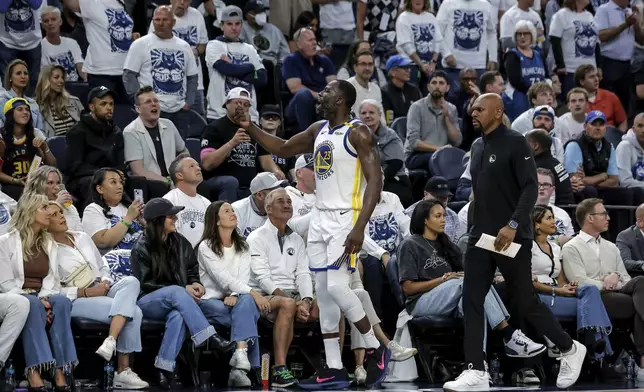 Golden State Warriors forward Draymond Green (23) reacts to the crowd during the first half of Game 2 of an NBA basketball second-round playoff series against the Minnesota Timberwolves, Thursday, May 8, 2025, in Minneapolis. (Carlos Avila Gonzalez/San Francisco Chronicle via AP)
