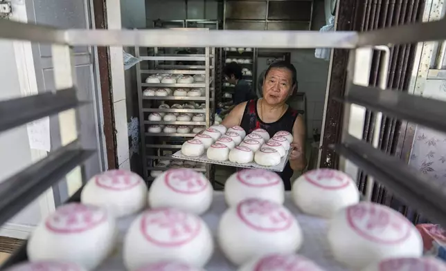 "Ping On" buns prepared for sale for the Bun Festival in Cheung Chau Island in Hong Kong, Monday, May 5, 2025. (AP Photo/Chan Long Hei)