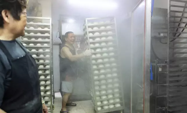 "Ping On" buns prepared for sale for the Bun Festival in Cheung Chau Island in Hong Kong, Monday, May 5, 2025. (AP Photo/Chan Long Hei)