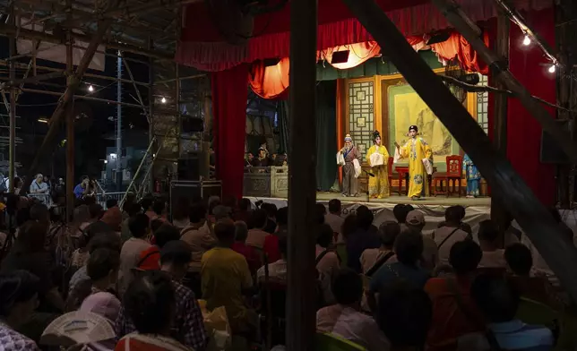Artists perform a Chinese opera during the Bun Festival in Cheung Chau Island in Hong Kong, Monday, May 5, 2025. (AP Photo/Chan Long Hei)