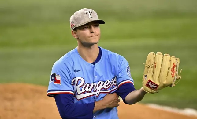 Texas Rangers starting pitcher Jack Leiter comes off the field after pitching against the Houston Astros during the fourth inning of a baseball game in Arlington, Texas, Sunday, May 18, 2025. (AP Photo/Jerome Miron)
