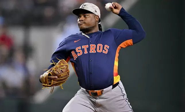 Houston Astros starting pitcher Framber Valdez (59) throws during the first inning against the Texas Rangers in a baseball game in Arlington, Texas, Sunday, May 18, 2025. (AP Photo/Jerome Miron)