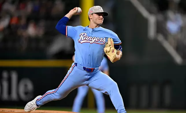 Texas Rangers starting pitcher Jack Leiter throws during the first inning against the Houston Astros in a baseball game in Arlington, Texas, Sunday, May 18, 2025. (AP Photo/Jerome Miron)