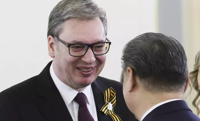 Serbian President Aleksandar Vucic, left, arrives to attend a working lunch with Chinese President Xi Jinping at the The Faceted Chamber of the Kremlin's Grand Palace at the Kremlin in Moscow, Russia, Thursday, May 8, 2025, ahead of celebrations of the 80th anniversary of the Soviet Union's victory over Nazi Germany during the World War II. (Mikhail Metzel, Sputnik, Kremlin Pool Photo via AP)