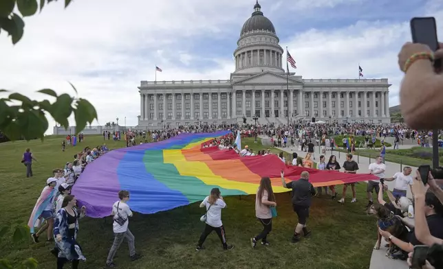 FILE - People march following a Pride rally at the Utah State Capitol, June 2, 2023, in Salt Lake City. (AP Photo/Rick Bowmer, File)
