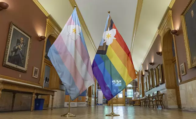 The newly adopted city flags are displayed at the Salt Lake City and County building showing support for LGBTQ+ in defiance of their state's Republican controlled Legislature, Wednesday, May 7, 2025, in Salt Lake City. (AP Photo/Melissa Majchrzak)