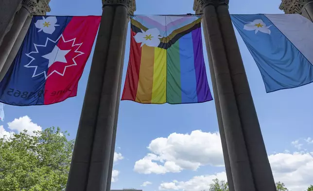 The newly adopted city flags are displayed at the Salt Lake City and County building showing support for LGBTQ+ in defiance of their state's Republican controlled Legislature, Wednesday, May 7, 2025, in Salt Lake City. (AP Photo/Melissa Majchrzak)