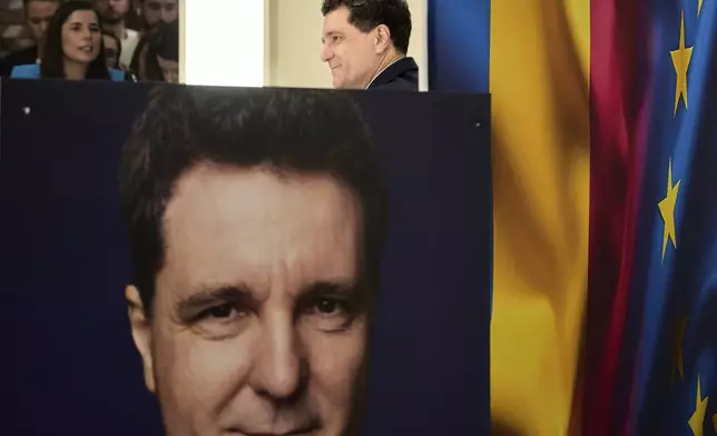 FILE - Presidential candidate Nicusor Dan holds a press conference the day after making it into the round of the country's presidential election redo in Bucharest, Romania, Monday, May 5, 2025. (AP Photo/Vadim Ghirda, File)