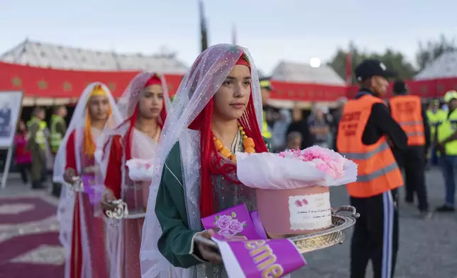 Girls take part in a beauty pageant during the annual Rose Festival in Kalaat M'Gouna, Morocco, Monday, May 5, 2025. (AP Photo/Mosa'ab Elshamy)