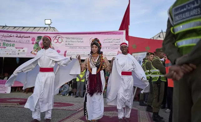 The winner of the Miss Rose beauty pageant joins a parade during the annual Rose Festival in Kalaat M'Gouna, Morocco, Monday, May 5, 2025. (AP Photo/Mosa'ab Elshamy)